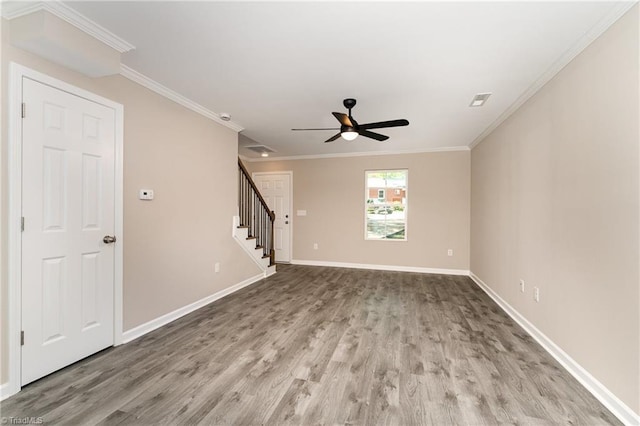 512 Guilford Ave, High Point, NC 27262 - unfurnished living room with stairway, wood finished floors, ceiling fan, baseboards, and ornamental molding