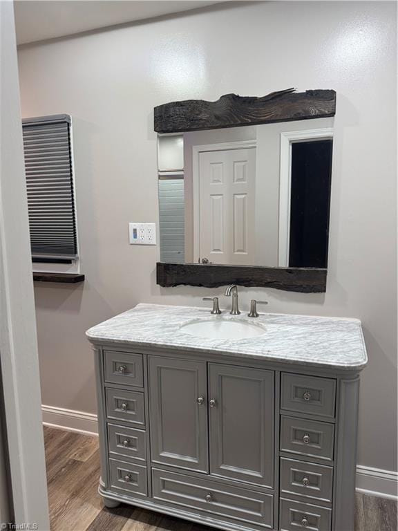 bathroom featuring vanity and wood-type flooring