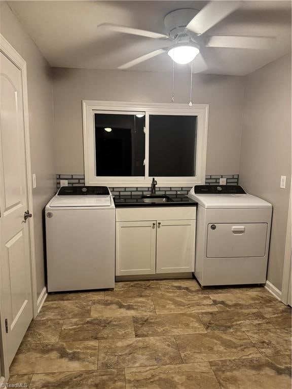 laundry area featuring washer / clothes dryer, cabinets, sink, and ceiling fan