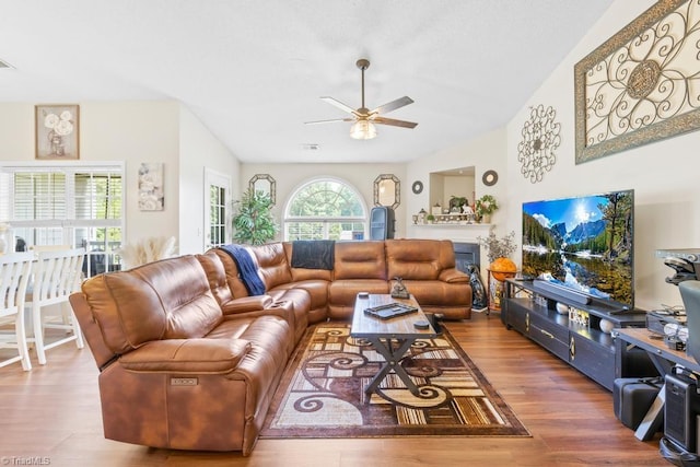6112 Hedgecock Cir Unit 3B, High Point, NC 27265 - living room with ceiling fan, wood finished floors, and a glass covered fireplace
