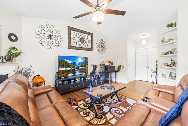 6112 Hedgecock Cir Unit 3B, High Point, NC 27265 - living room featuring a ceiling fan, vaulted ceiling, wood finished floors, and baseboards
