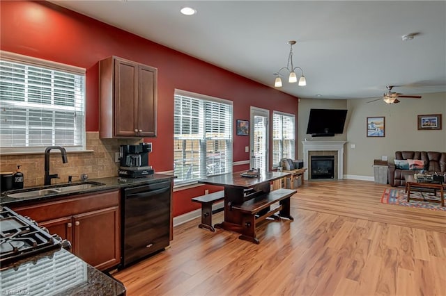4548 River Gate Dr, Clemmons, NC 27012 - kitchen featuring dishwasher, a sink, a ceiling fan, light wood-style flooring, and baseboards