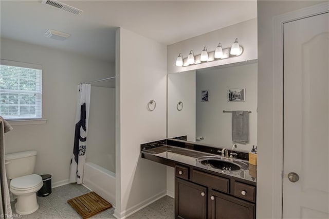 4548 River Gate Dr, Clemmons, NC 27012 - bathroom featuring toilet, baseboards, vanity, and shower / bath combo with shower curtain