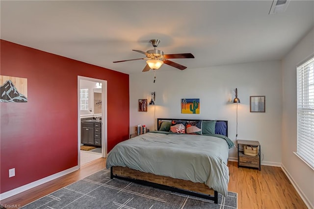 4548 River Gate Dr, Clemmons, NC 27012 - bedroom with wood finished floors, ceiling fan, baseboards, and connected bathroom