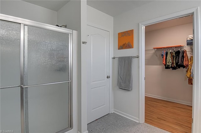 4548 River Gate Dr, Clemmons, NC 27012 - full bath featuring a shower stall, a spacious closet, and baseboards