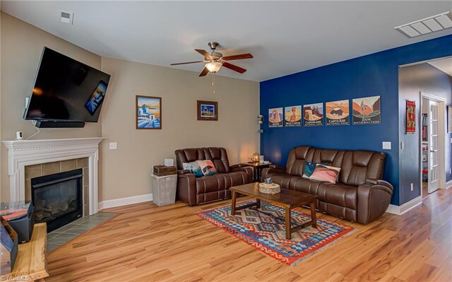 4548 River Gate Dr, Clemmons, NC 27012 - living room with ceiling fan, wood finished floors, a fireplace, and baseboards