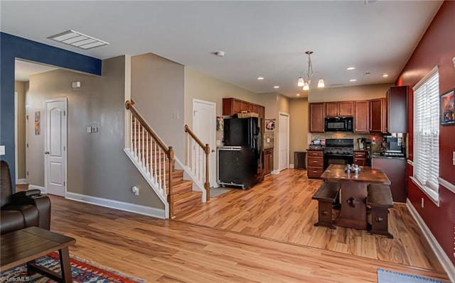 4548 River Gate Dr, Clemmons, NC 27012 - living area featuring light wood-style flooring, baseboards, stairs, a chandelier, and recessed lighting