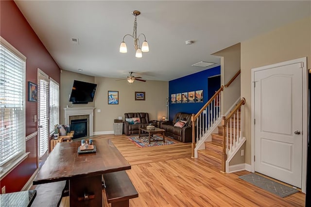 4548 River Gate Dr, Clemmons, NC 27012 - living area with ceiling fan, stairs, wood finished floors, and a tiled fireplace