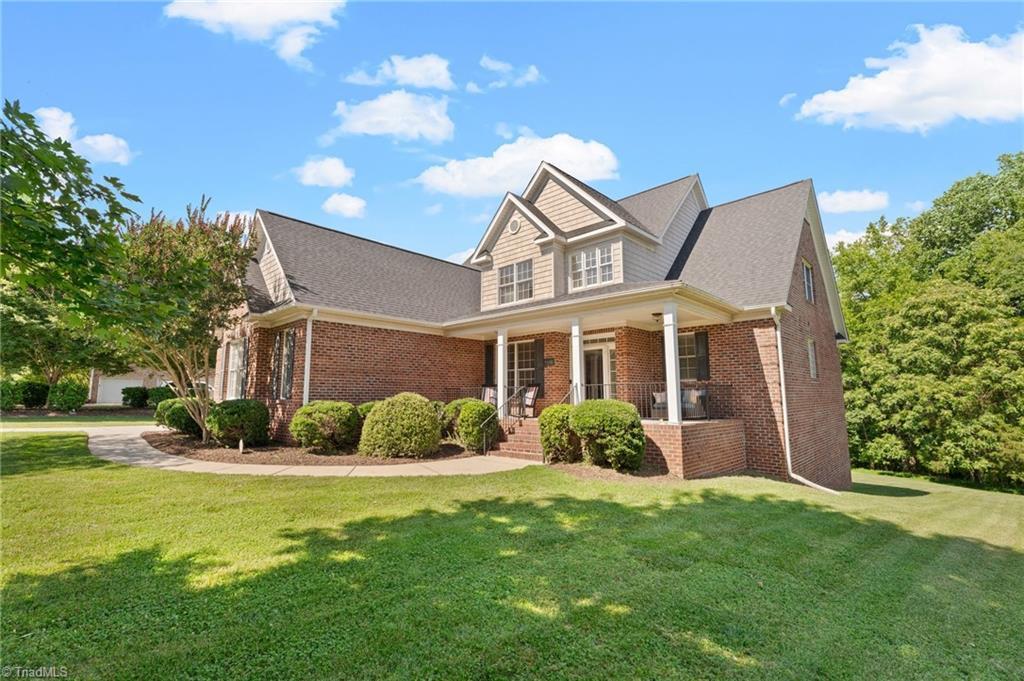 craftsman-style house with a porch and a front yard