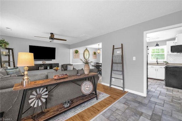 6937 US Highway 158, Stokesdale, NC 27357 - living room featuring stone finish floors and ceiling fan