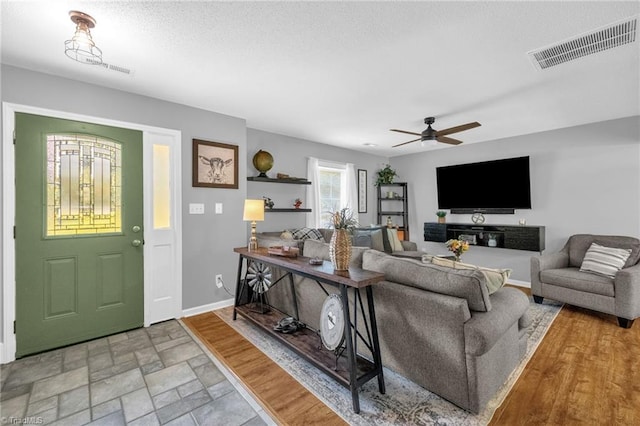 6937 US Highway 158, Stokesdale, NC 27357 - living room featuring ceiling fan and light stone finish floors