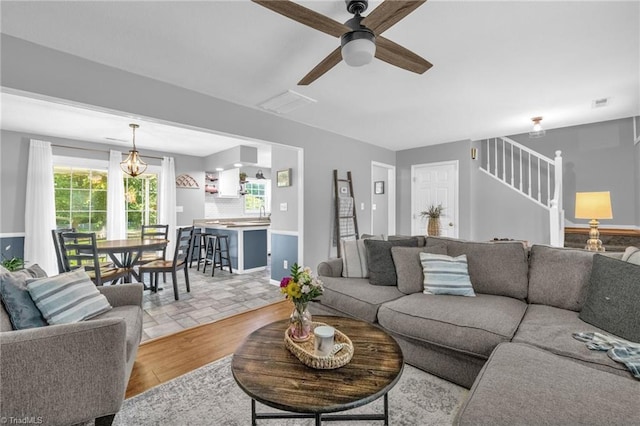 6937 US Highway 158, Stokesdale, NC 27357 - living area with stairway and ceiling fan
