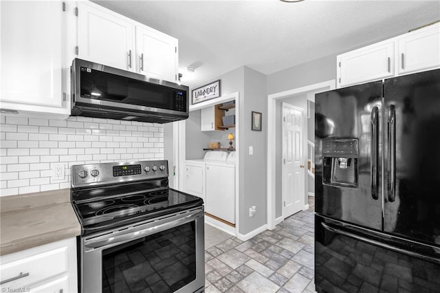 6937 US Highway 158, Stokesdale, NC 27357 - kitchen featuring appliances with stainless steel finishes, washing machine and clothes dryer, white cabinets, decorative backsplash, and light countertops