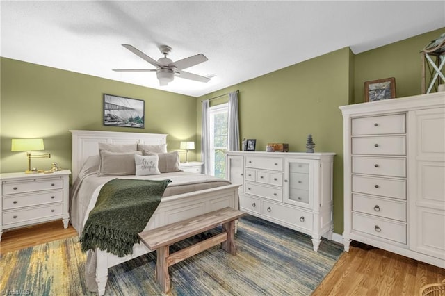 6937 US Highway 158, Stokesdale, NC 27357 - bedroom with wood finished floors and ceiling fan