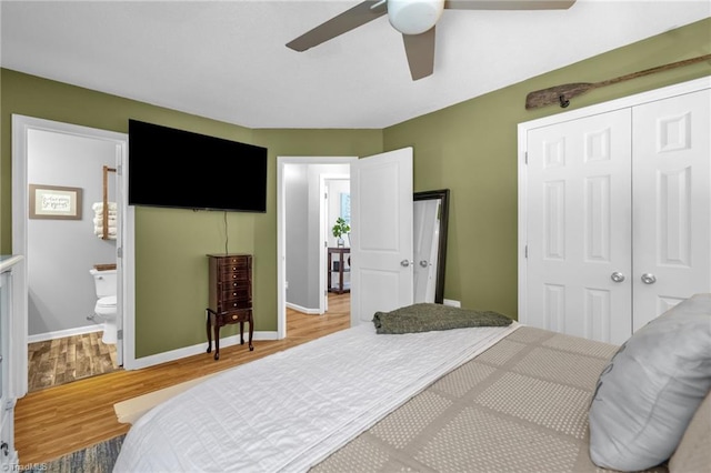 6937 US Highway 158, Stokesdale, NC 27357 - bedroom featuring wood finished floors, a closet, a ceiling fan, and ensuite bath