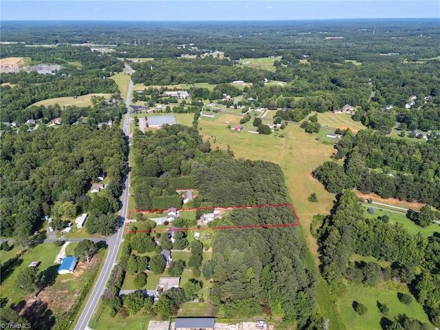 6937 US Highway 158, Stokesdale, NC 27357 - aerial view of property and surrounding area with property parcel outlined and a heavily wooded area