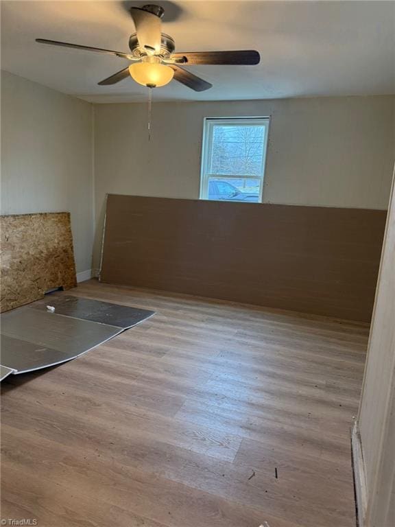 unfurnished room with light hardwood / wood-style floors