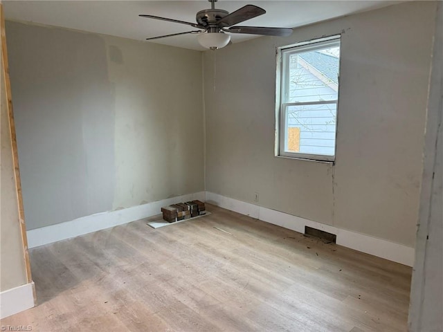 spare room with ceiling fan and light hardwood / wood-style flooring