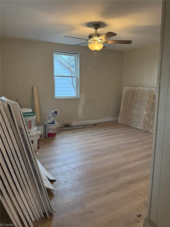 spare room with ceiling fan and light hardwood / wood-style floors