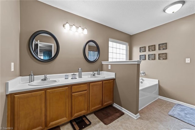 full bath with tile patterned flooring, a garden tub, a sink, and double vanity