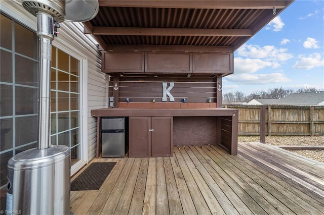 wooden deck featuring fence