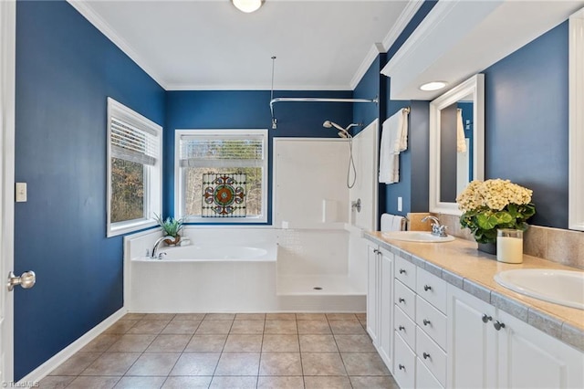 bathroom with a garden tub, tile patterned floors, ornamental molding, a sink, and walk in shower