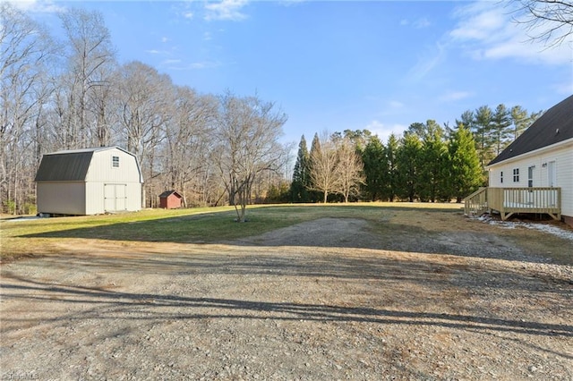 exterior space featuring a barn and driveway