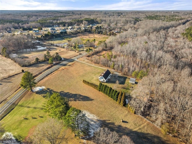 birds eye view of property featuring a rural view