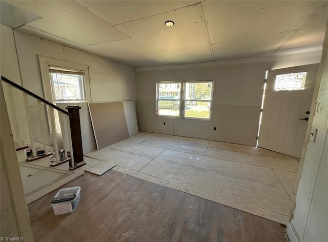 entryway with stairs and wood finished floors