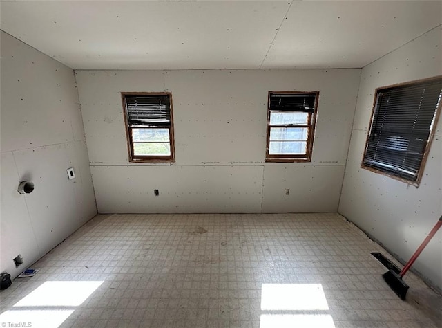 unfurnished room featuring light floors