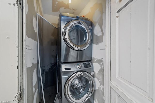 laundry area featuring laundry area and stacked washer and clothes dryer