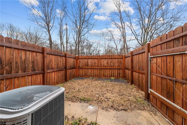 view of yard featuring a fenced backyard and cooling unit