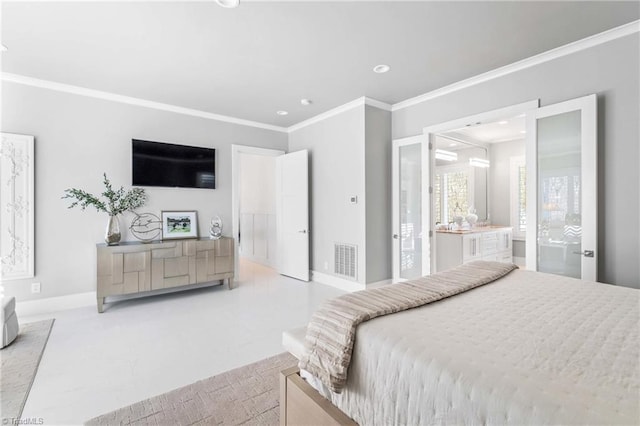 bedroom featuring ornamental molding and ensuite bath