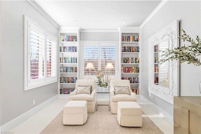 sitting room with built in features and ornamental molding