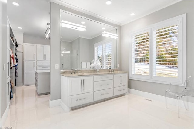 bathroom featuring vanity and crown molding