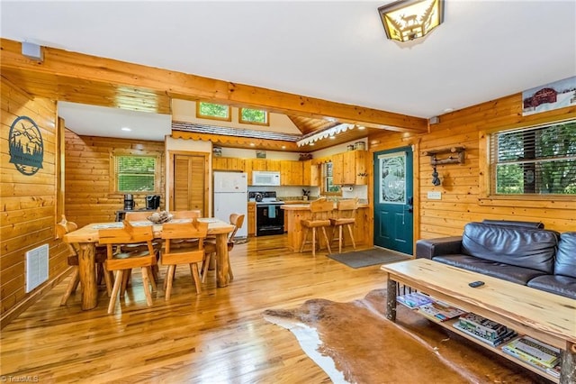 240 Deer Knoll Dr, Piney Creek, NC 28663 - living room with light wood finished floors, wood walls, and beamed ceiling