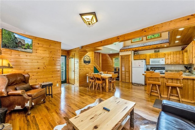 240 Deer Knoll Dr, Piney Creek, NC 28663 - living area with light wood-type flooring and wood walls