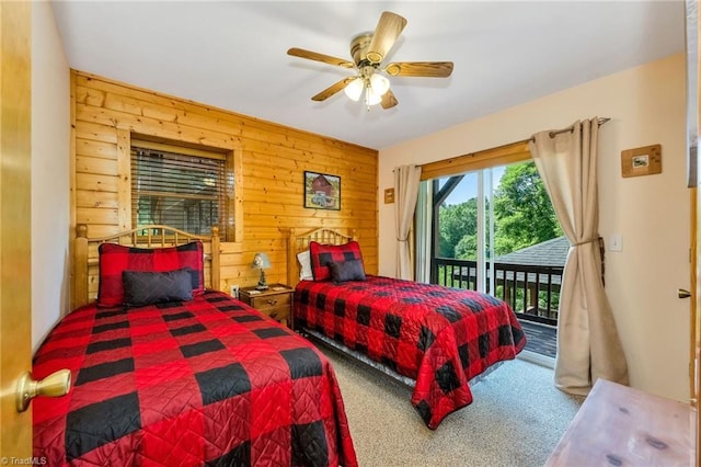 240 Deer Knoll Dr, Piney Creek, NC 28663 - bedroom with carpet, access to outside, wood walls, and ceiling fan