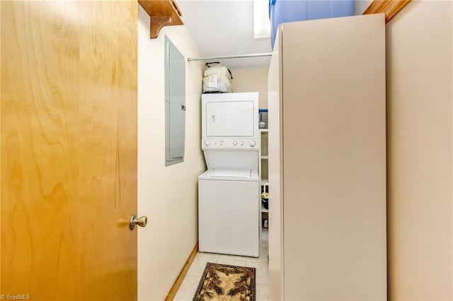 240 Deer Knoll Dr, Piney Creek, NC 28663 - laundry room featuring stacked washer / dryer and tile patterned flooring