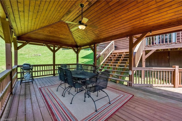 240 Deer Knoll Dr, Piney Creek, NC 28663 - wooden terrace featuring outdoor dining space, stairs, ceiling fan, and area for grilling