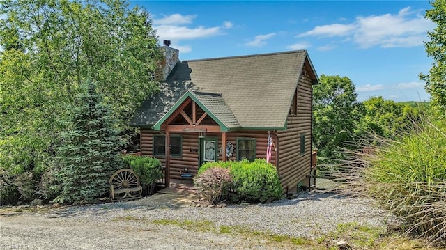 240 Deer Knoll Dr, Piney Creek, NC 28663 - cabin featuring a porch, roof with shingles, faux log siding, and a chimney