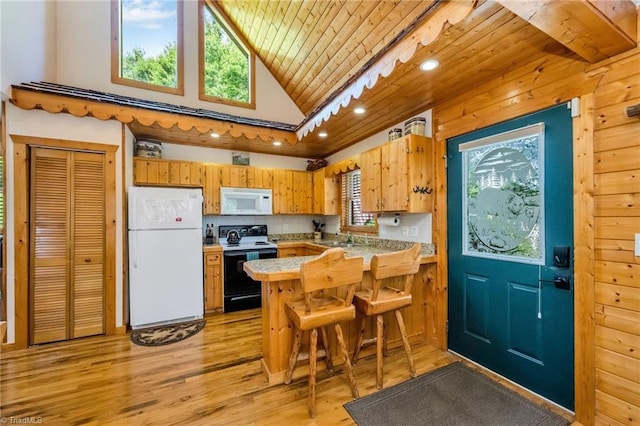 240 Deer Knoll Dr, Piney Creek, NC 28663 - kitchen featuring white appliances, wooden ceiling, light wood-style flooring, a peninsula, and light countertops