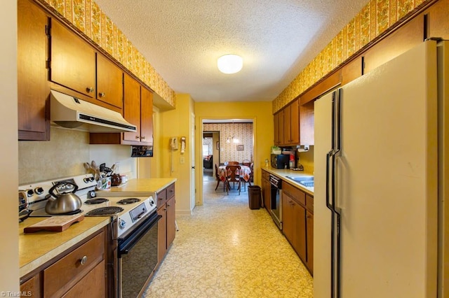 kitchen with dishwashing machine, light floors, freestanding refrigerator, range with electric cooktop, and under cabinet range hood