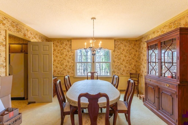 dining space with a notable chandelier, light colored carpet, a textured ceiling, and wallpapered walls