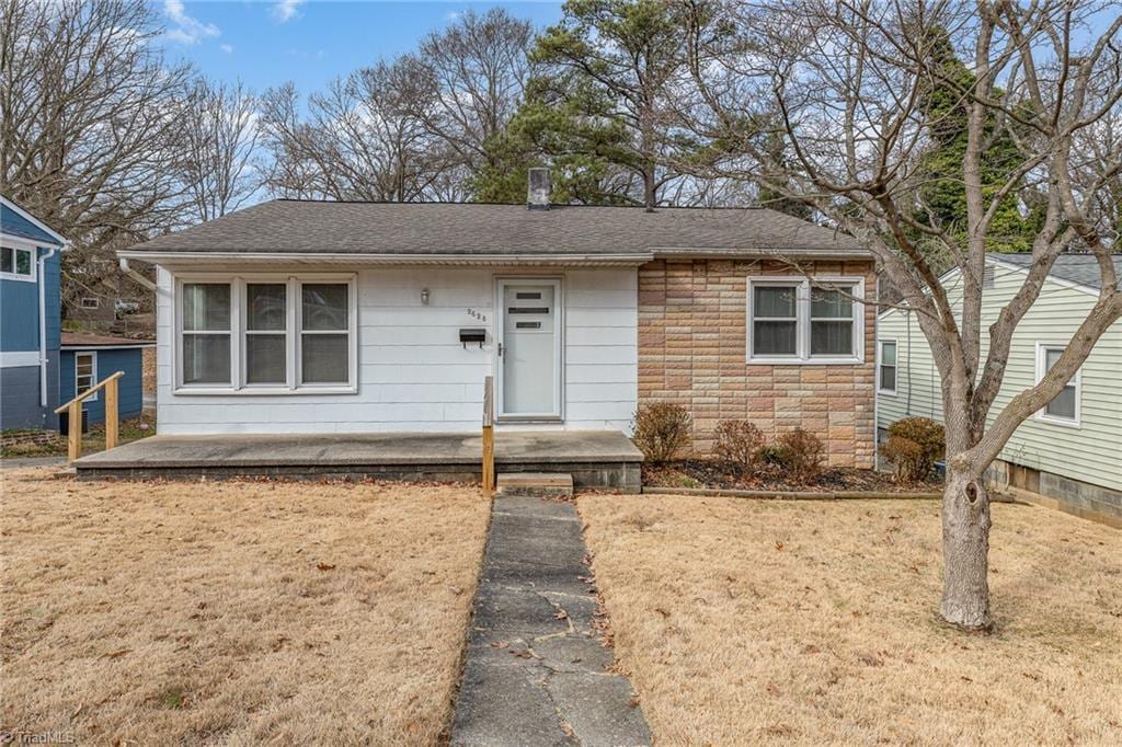 bungalow with a front yard