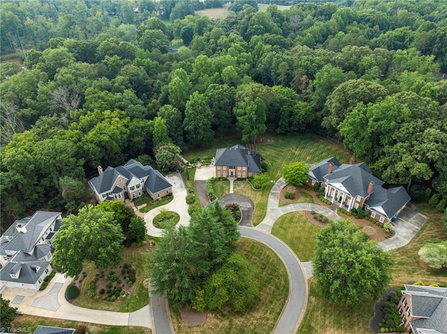 aerial view with a residential view and a view of trees