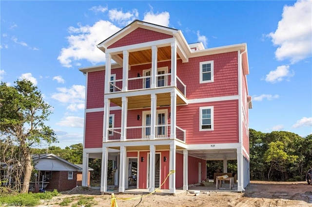 back of property with a balcony