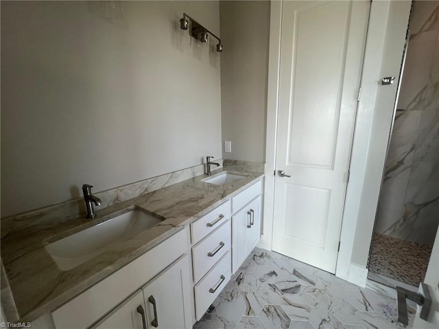 bathroom with walk in shower and vanity