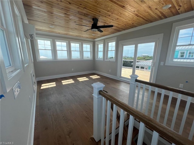 interior space featuring wood ceiling, ornamental molding, dark wood-type flooring, and a wall mounted AC