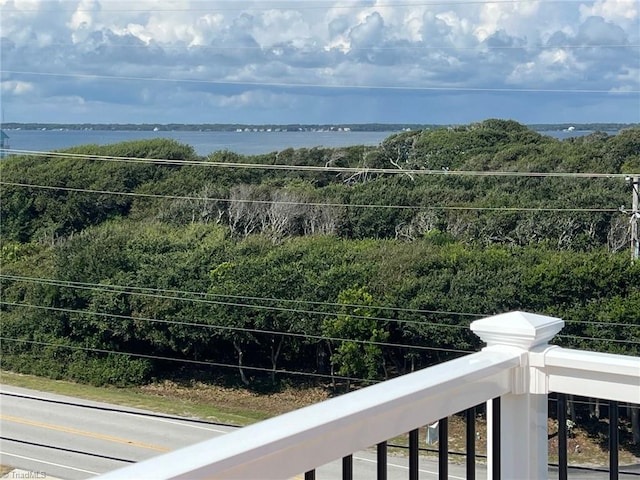 balcony featuring a water view